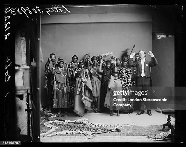 Members of The African Choir, and their English musical director, James Balmer , pose for a group portrait as if performing 'Does Anybody Here Know...