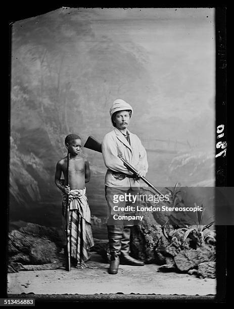 British explorer and journalist Sir Henry Morton Stanley with his personal servant and adopted child Kalulu , circa 1872. Kalulu accompanied Stanley...