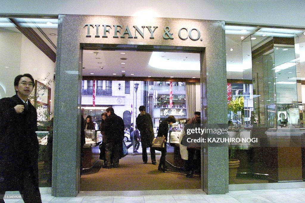 Japanese customers buy jewelry at a Tiffany shop w