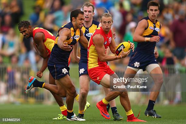 Matt Shaw of the Suns looks to pass the ball during the 2016 AFL NAB Challenge match between the West Coast Eagles and the Gold Coast Suns at HBF...