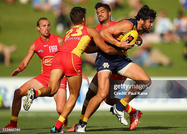 Josh Kennedy of the Eagles looks to break from a tackle during the 2016 AFL NAB Challenge match between the West Coast Eagles and the Gold Coast Suns...