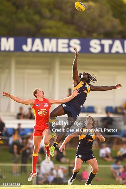 Nic Naitanui of the Eagles contests a ruck with Daniel Currie of the Suns during the 2016 NAB Challenge match between the West Coast Eagles and the...