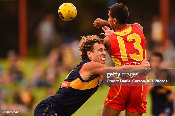 Callum Ah Chee of the Suns is tackled by Matt Priddis of the Eagles during the 2016 NAB Challenge match between the West Coast Eagles and the Gold...