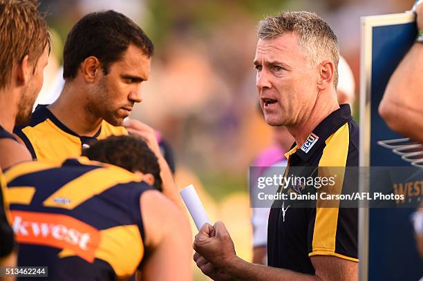 Adam Simpson, coach of the Eagles addresses the team at three quarter time during the 2016 NAB Challenge match between the West Coast Eagles and the...