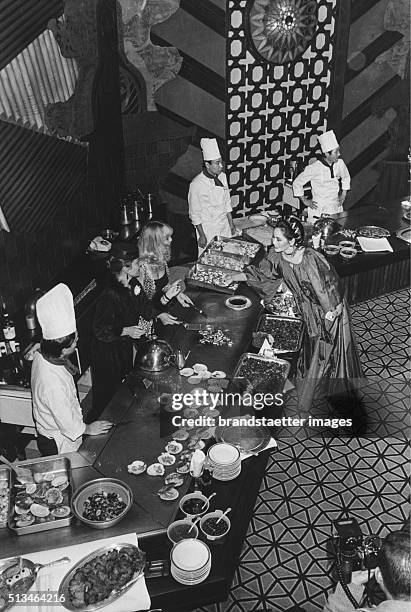 The widow of the indonesian prime minister Sukarno Ratna Sari Dewi Sukarnomit with the actresses Mylne Demongeot and Claudine Auger a the opening of...