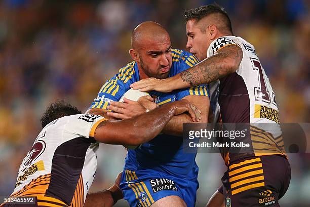 Tim Mannah of the Eels is tackled during the round one NRL match between the Parramatta Eels and the Brisbane Broncos at Pirtek Stadium on March 3,...