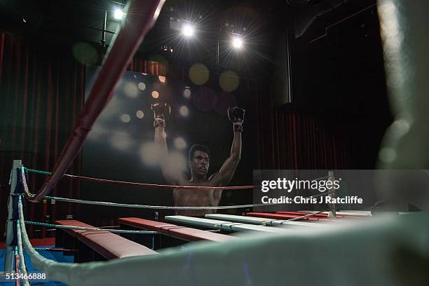 Poster of Muhammad Ali on display next to a boxing ring - at the preview of the 'I Am The Greatest' Muhammad Ali exhibition on March 3, 2016 in...