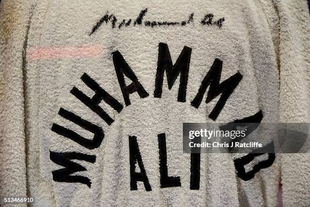 Signed 'Float like a butterfly sting like a bee' robe worn by Ali's cornerman Bundini Brown at the 'Rumble in the Jungle' fight - at the preview of...