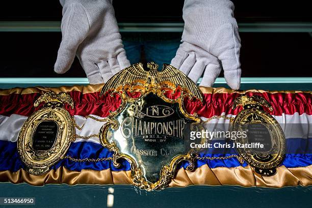 Curator handles a replica of the Cassius Clay 1964 Championship belt - at the preview of the 'I Am The Greatest' Muhammad Ali exhibition on March 3,...