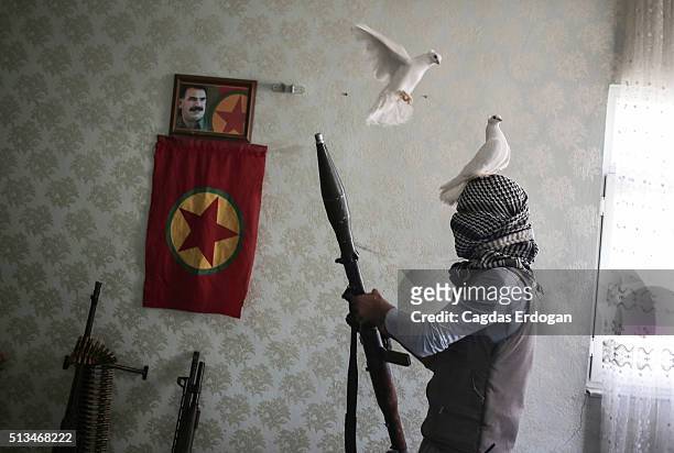 Member of a armed group Patriotic Revolutionary Youth Movement , a youth division of the Kurdistan Workers' Party, PKK, prepares his holds a Rocket...