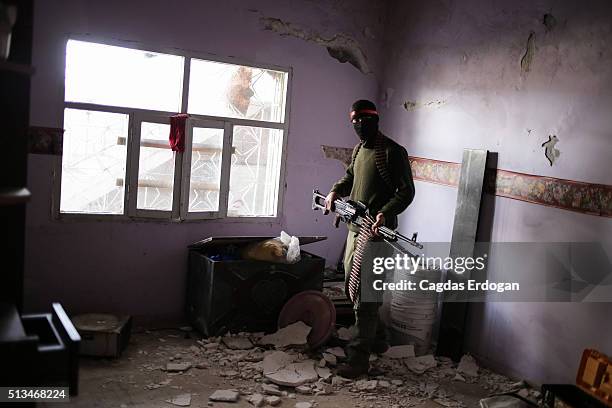 Member of a armed group Patriotic Revolutionary Youth Movement , a youth division of the Kurdistan Workers' Party, PKK, stand guards with his...