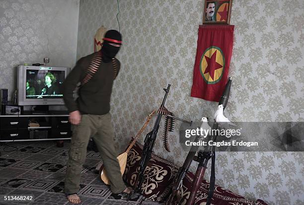 White pigeons perch on weapons of armed group Patriotic Revolutionary Youth Movement , a youth division of the Kurdistan Workers' Party, PKK, in a...