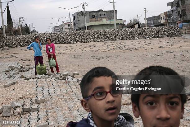 Kurdish children is seen in front of the barricades built by armed group Patriotic Revolutionary Youth Movement , a youth division of the Kurdistan...
