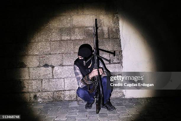 Member of armed group Patriotic Revolutionary Youth Movement , a youth division of the Kurdistan Workers' Party, PKK, prepare for an attack to...