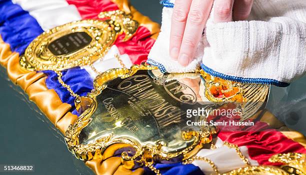 Replica of the 1964 Cassius Clay Championship Belt is cleaned during a preview of the Muhammad Ali exhibition entitled 'I Am The Greatest', at The O2...