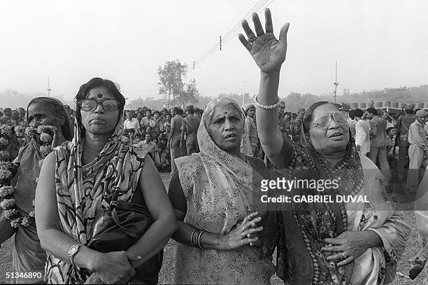 Women shown in file photo dated 03 November 1984 assisting Indira Gandhi's cremation in New Delhi.
