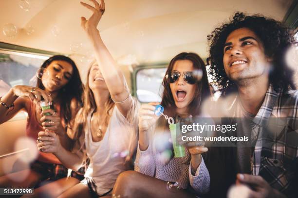 hipster amigos teniendo una fiesta en las burbujas vintage van - people inside bubbles fotografías e imágenes de stock