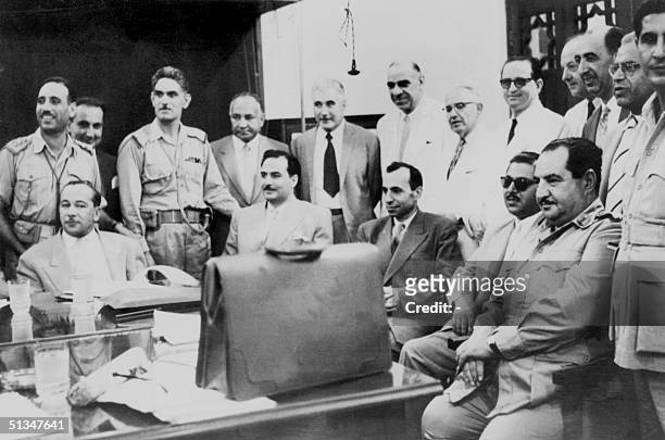 From left, seated: Iraqi politician Abdul Salam Arif and Iraqi Prime minister brigadier Abdul-Karim Qassem , are surrounded by the members of Iraqi...