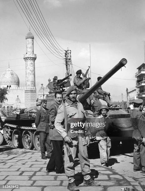 Iraqi soldiers patrol downtown Baghad 08 February 1963 after members of the pan-Arab Ba'ath party led a successful coup d'etat against the brigadier...