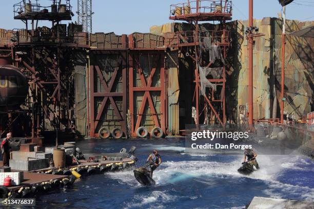 View of two stunt performers on Jet-Skis during Universal Studios Hollywood's 'Waterworld: A Live Sea War Spectacular' show, Los Angeles, California,...