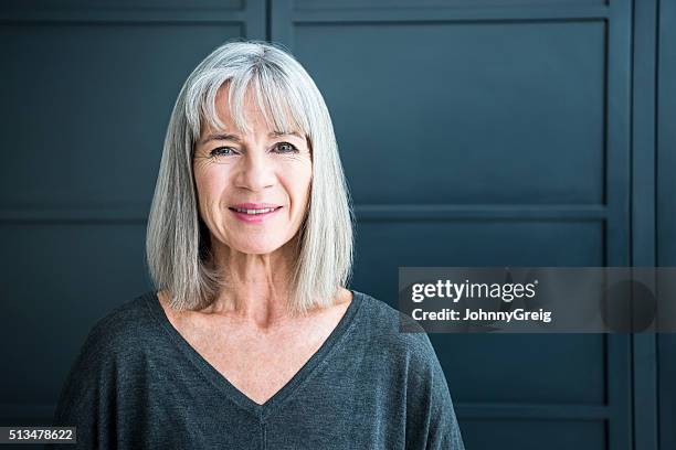 portrait of a senior woman smiling towards camera - bobbed hair 個照片及圖片檔