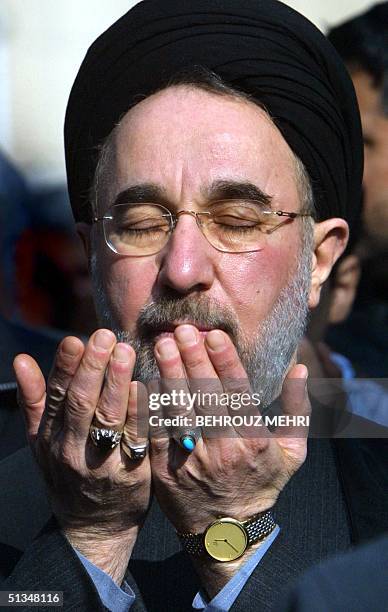 Iranian President Mohammed Khatami takes part in Friday prayers following a rally to mark "Al-Qods Day" in Tehran 29 November 2002. Hundreds of...