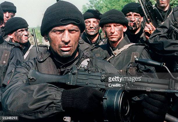 Several commandos, members of the Arkan's Tigers train 17 June 1995 in Osijek, a Serb-held area of Slavonia, a region in eastern Croatia. In 1990,...