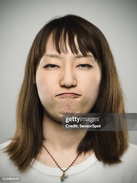 portrait of a young japanese woman. - girl mugshots stock pictures, royalty-free photos & images