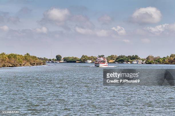 cruising in rhone river - camargue - france - rhone river stock pictures, royalty-free photos & images