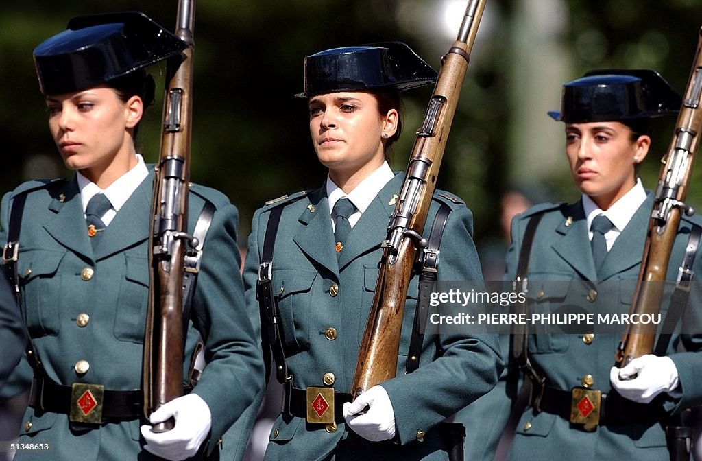 Three Spanish "Guardia Civil" women parade during