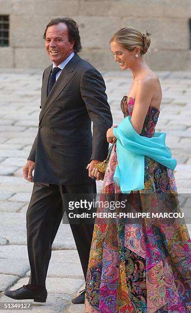 Spanish singer Julio Iglesias and his wife Miranda arrive for the wedding of Ana Aznar, daughter of Spanish Government chief Jose Maria Aznar with...