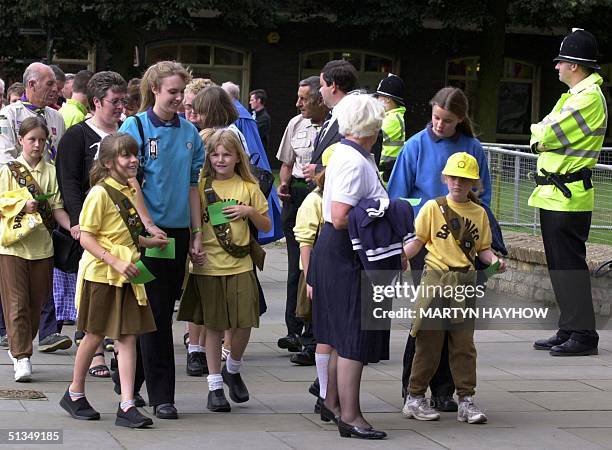 Members of Soham Brownie pack, arrive at Ely Cathedral, Cambridgeshire, 30 August 2002, to attend the Service of Celebration & Rememberance for Holly...