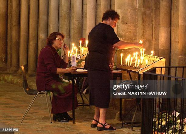 Two visitors to Ely Cathedral, Cambridgeshire, pay their respects, 30 August 2002, prior to this afternoon's service of Celebration & Rememberance of...