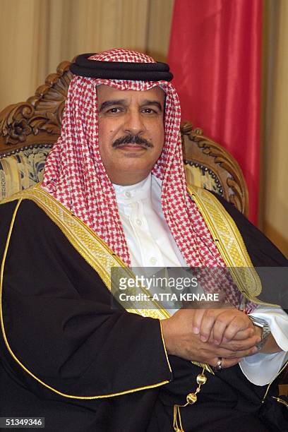 King Hamad bin Issa al-Khalifa of Bahrain poses for photographers during his meeting with Iranian President Mohammad Khatami in Tehran 17 August...