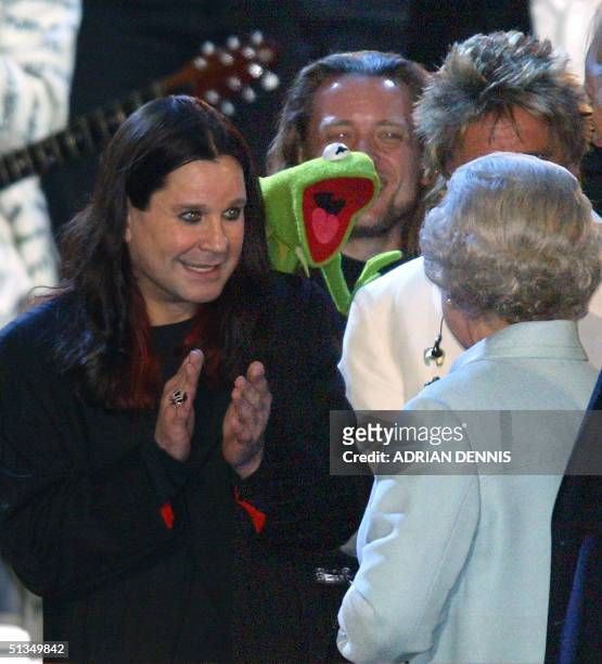 The Queen is introduced to Ozzy Osbourne and Kermit the Frog on stage during "Party at the Palace" in London 03 June 2002. As part of Queen...
