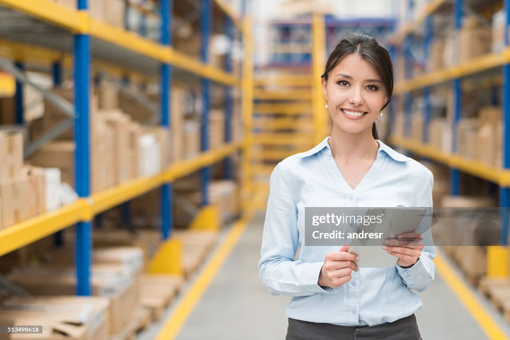 Business woman working at a warehouse