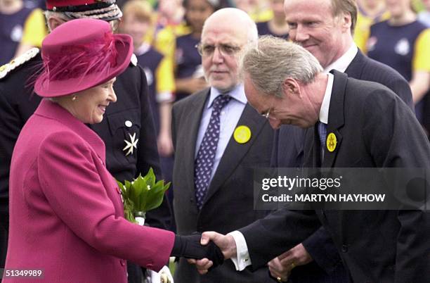 Britain's Queen Elizabeth II shakes hands with Sven-Goran Eriksson, the England soccer team manager 10 May 2002, as she visited the National Sports...