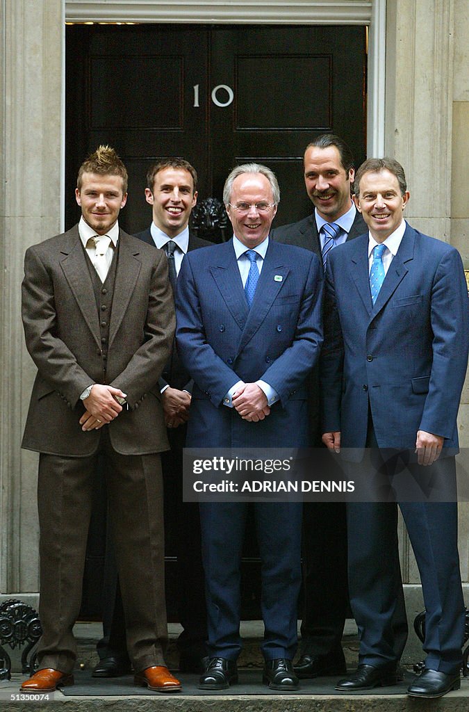 Britain's Prime Minister Tony Blair (R) with playe