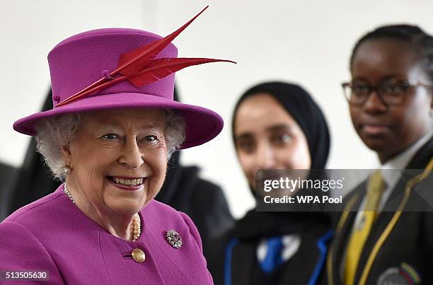 Queen Elizabeth II smiles during a Queen's Trust visit to the Lister Community School in Plaistow on March 3, 2016 in London, England.