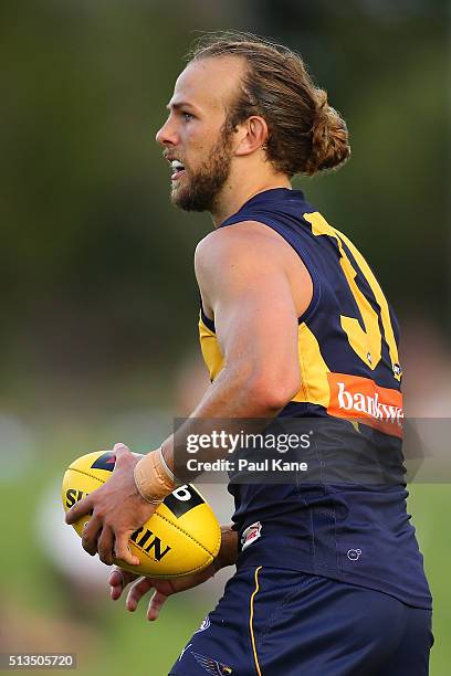 Will Schofield of the Eagles looks to pass the ball during the 2016 AFL NAB Challenge match between the West Coast Eagles and the Gold Coast Suns at...