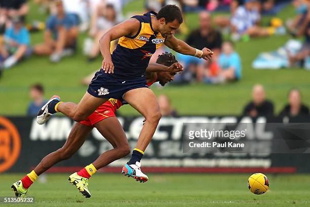Josh Hill of the Eagles bumps Jarrod Garlett of the Suns during the 2016 AFL NAB Challenge match between the West Coast Eagles and the Gold Coast...