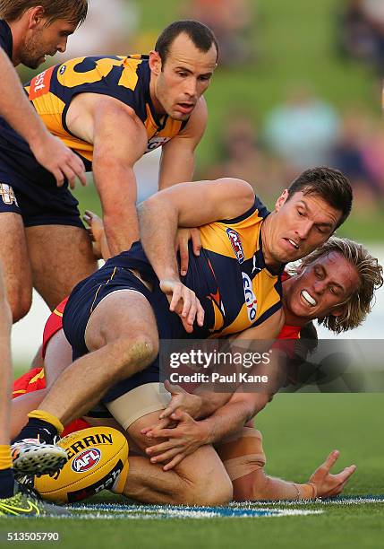 Sam Butler of the Eagles and Darcy MacPherson of the Suns contest for the ball during the 2016 AFL NAB Challenge match between the West Coast Eagles...