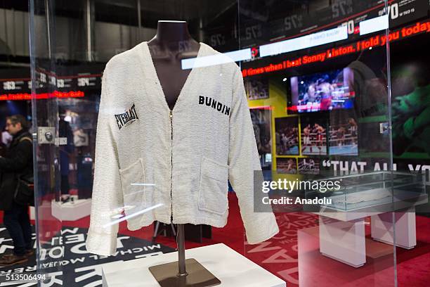 Signed Muhammad Ali half length cotton robe embroidered on the back with 'Float like a butterfly sting like a bee' during a press call at 'I Am The...