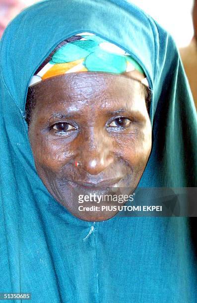 Safiya Husseini smiles in the courtroom of Sokoto State Sharia Court of Appeal, 25 March, 2002. The Islamic court freed the mother-of-five, who had...