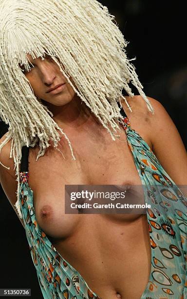 Model walks the runway during the Michiko Koshino fashion show as part of London Fashion Week Spring/Summer 2005 at the BFC Tent, Duke of York's HQ,...