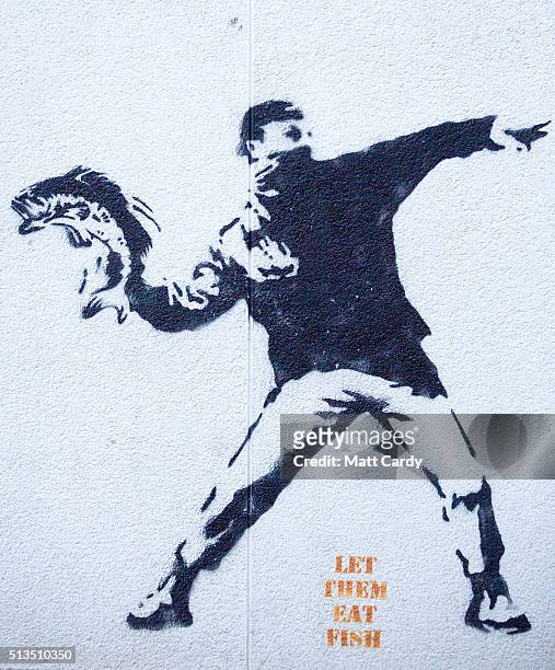Stencil is seen on a wall in Brixham harbour on March 2, 2016 in Devon, England. The UK's fishing industry is likely to be radically affected by the...