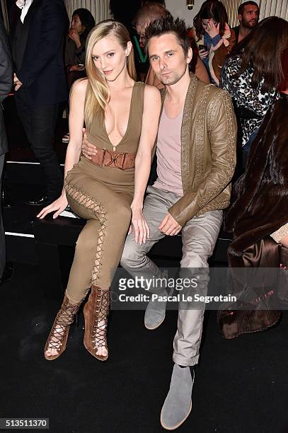 Elle Evans and Matt Bellamy attend the Balmain show as part of the Paris Fashion Week Womenswear Fall/Winter 2016/2017 on March 3, 2016 in Paris,...