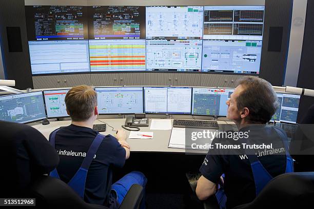 Leuna, Germany An employee of InfraLeuna GmbH seated in the central control room of the work in front of computer monitors on March 03, 2016 in...