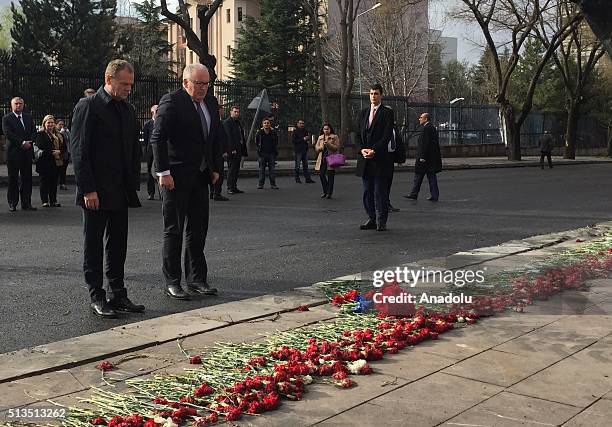 President of the European Council, Donald Tusk and First Vice-President of the European Commission, Frans Timmermans lay carnations as they visit the...