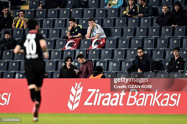 Fenerbahce`s fans display Turkish flags with a portrait of Mustafa Kemal Ataturk, founder of modern Turkey, during the Zirrat Tukish Cup fotball...